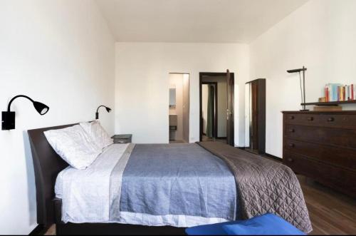 Postel nebo postele na pokoji v ubytování Salesiani Room A