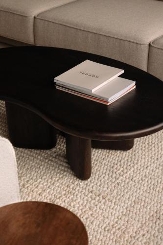 a book on a coffee table in a living room at stilwerk Strandhotel Blankenese in Hamburg