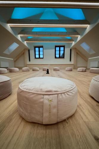 a large room with a large white bean bag chair at Holiday Home Huty by Interhome in Jimramov