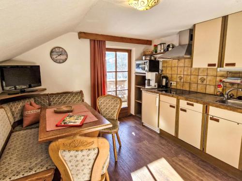 a kitchen and dining room with a table and chairs at Apartment Haflingerhof Edelweiß by Interhome in Kaunertal