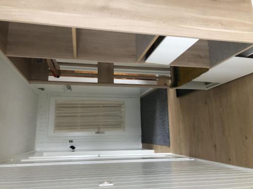 an empty room with a window and a ceiling at Apartment Sunnegruess by Interhome in Adelboden