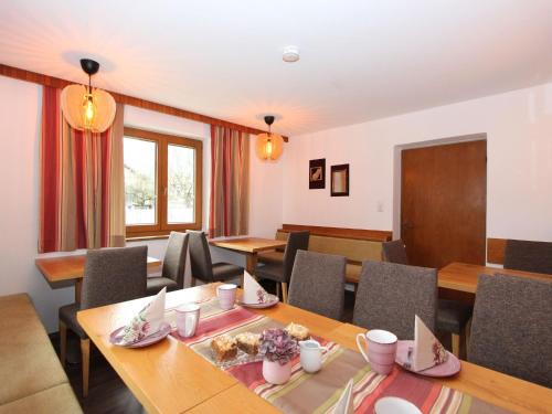 a conference room with tables and chairs and a podium at Holiday Home Sonnblick by Interhome in Uderns