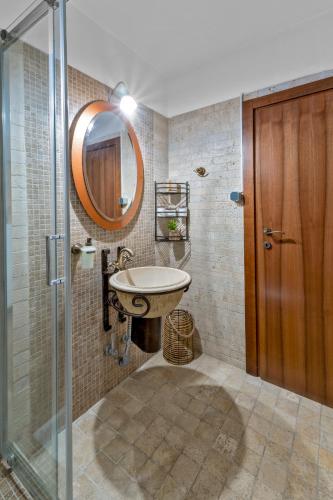 a bathroom with a sink and a mirror at Manor House est. 1890 in Kastoria