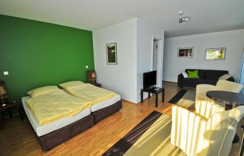 Postel nebo postele na pokoji v ubytování Heldts Aparthotel