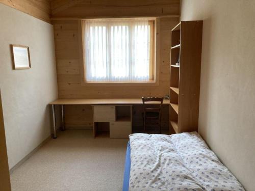Ένα ή περισσότερα κρεβάτια σε δωμάτιο στο Apartment Fichte - Sulliger by Interhome