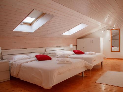 two beds in a room with skylights at Apartment Residenz Marina by Interhome in Bouveret