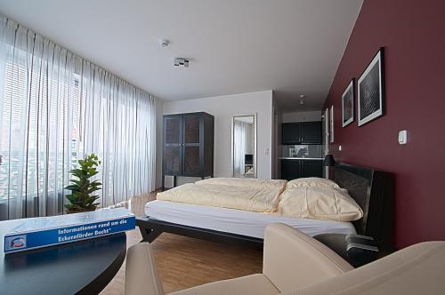 Postel nebo postele na pokoji v ubytování Heldts Aparthotel