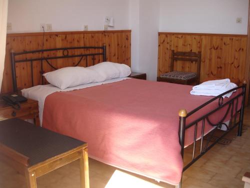 Postel nebo postele na pokoji v ubytování Hotel Inomaos