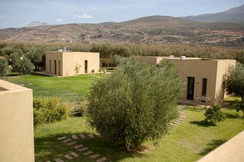 a view of a house with mountains in the background at Atlas Retreat Luxury Bed and Breakfast in Beni Mellal