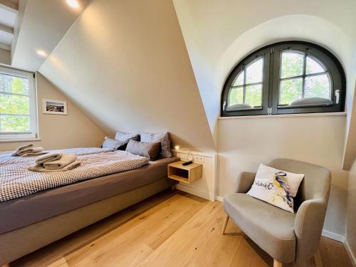 En eller flere senge i et værelse på Ferienhaus Blaumeise Feriendorf 06 Klein Stresow Rügen by ruyastay