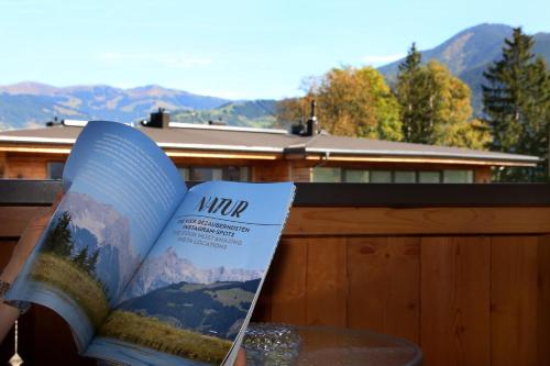 a book sitting on top of a table at Gästehaus Trixl in Zell am See
