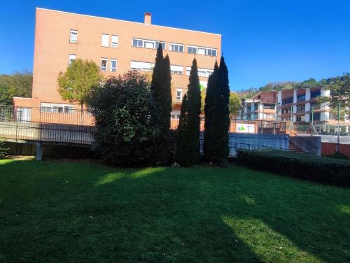 a group of trees in front of a building at Miresibilbao - Residencia Universitaria in Bilbao