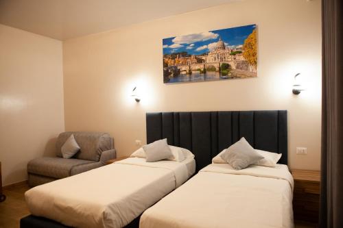 a hotel room with two beds and a chair at Vatican Bliss in Rome
