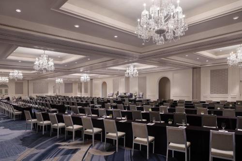 a large room with rows of chairs and chandeliers at The Ritz-Carlton, Laguna Niguel in Dana Point