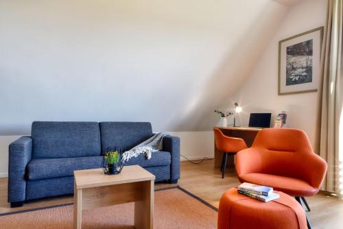 Ruang duduk di Ferienwohnung Bartmeise 38 im Wreecher Idyll Rügen by ruyastay