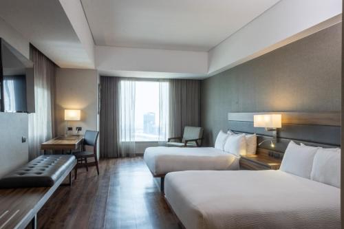 Ένα ή περισσότερα κρεβάτια σε δωμάτιο στο AC Hotel by Marriott Santa Fe