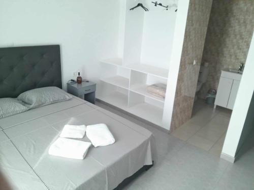 Postel nebo postele na pokoji v ubytování Hostel Rocha Marisol