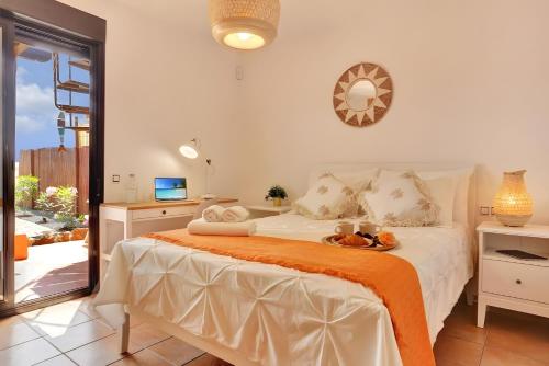 En eller flere senge i et værelse på Casa Bonita Lajares 3