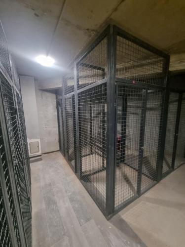 an empty room with a cage in a building at Bjelasnica View Lodge Apartman in Bjelašnica