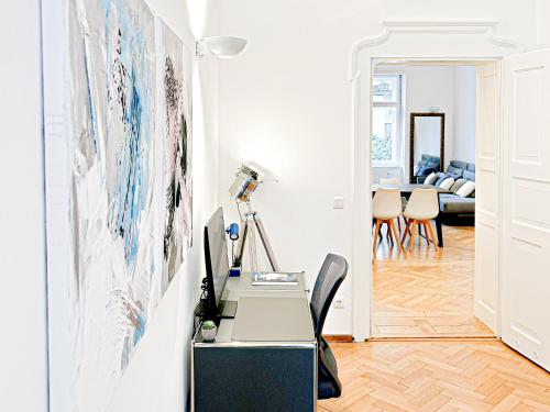 an office with a desk and a table at TheGallery in Munich