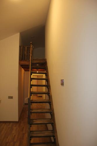 a staircase leading up to a loft in a room at Colour in Baku