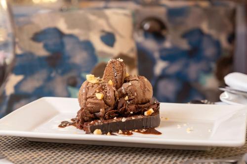 a chocolate dessert on a plate on a table at Protea Hotel by Marriott Blantyre Ryalls in Blantyre