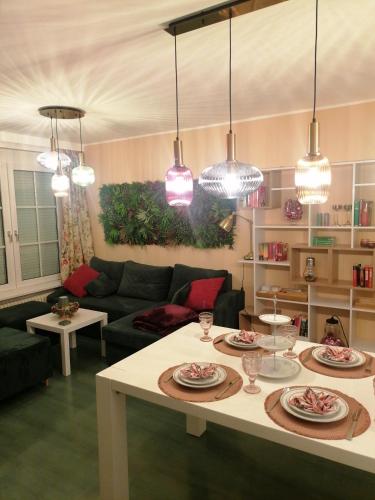 a living room with a table with plates on it at Alpenblumal in Bad Goisern