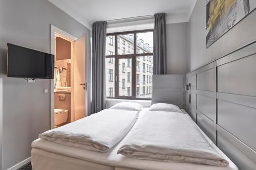 Postel nebo postele na pokoji v ubytování Four Points Flex by Sheraton Copenhagen City