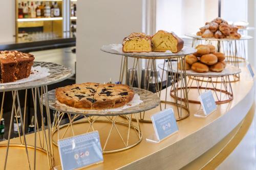 a display case with different types of cakes and pastries at Donna Camilla Savelli - VRetreats in Rome