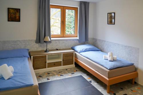 Posteľ alebo postele v izbe v ubytovaní Apartmány Klatovská