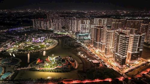 an aerial view of a city at night at Suzon-Luxurious Apartment at Lumiere Boulevard VGP in Gò Công