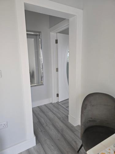 a living room with a couch and a mirror at Cuas view in Dingle