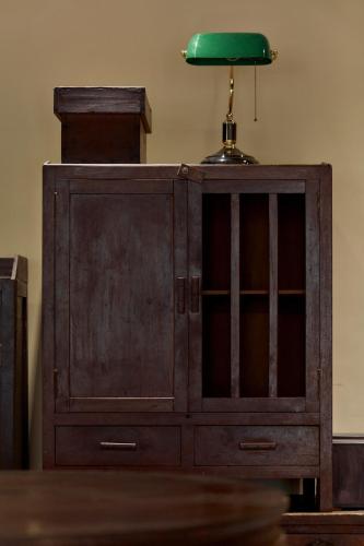 a wooden cabinet with a green lamp on top at 三和大旅社 in Changhua City