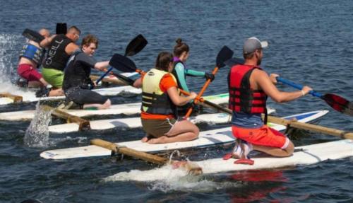a group of people on paddle boards in the water at Rubys Happy Haven in Crowle