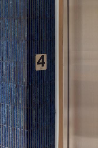 a glass door with the number four on it at 三和大旅社 in Changhua City