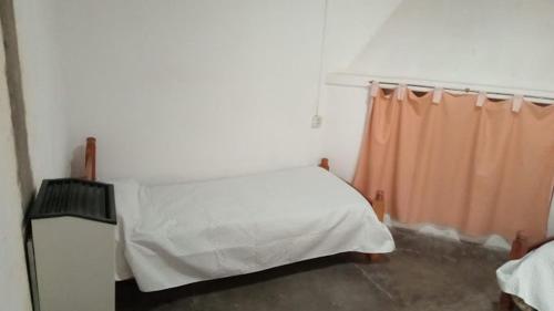 Ένα ή περισσότερα κρεβάτια σε δωμάτιο στο Casa Abuela Chicha