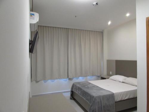 Ein Bett oder Betten in einem Zimmer der Unterkunft Hotel Urbis a 10 minutos Rua 25 de Março, Brás,Bom Retiro,a 2 minutos do Mirante Sampa Sky