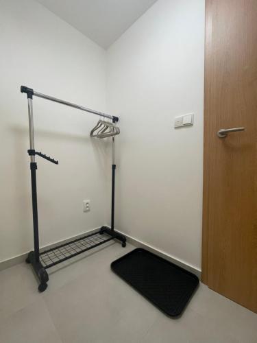 a gym room with a treadmill next to a door at Apartmán Bellevue in Boskovice