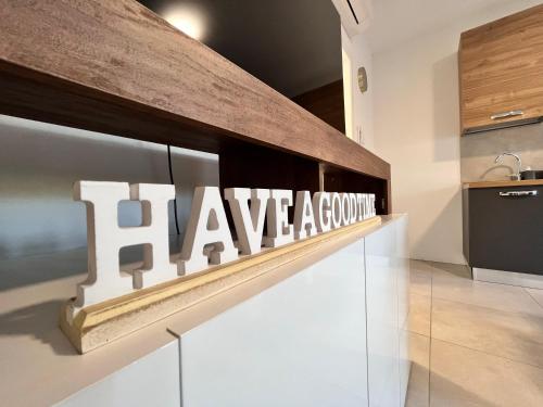 a kitchen with a sign that reads have a ground at La rocca - private Garden in Darfo