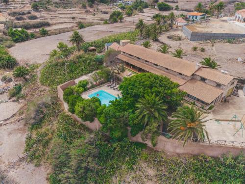 an aerial view of a house with a swimming pool at Alojamento Casas da Serra in Porto Santo