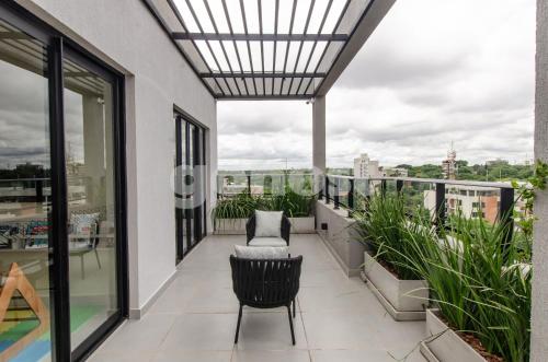 an apartment balcony with a view of the city at Luxe 2 Bedroom Apt In The Heart Of Villa Morra in Asuncion