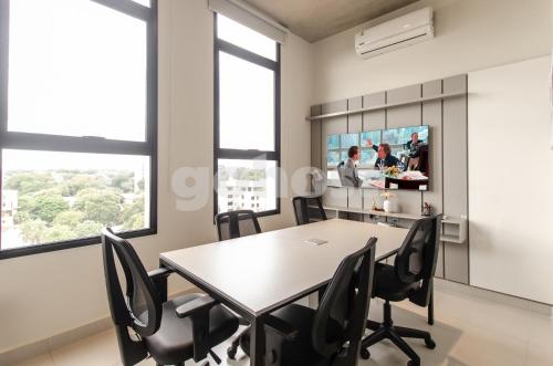 a dining room with a table and chairs at Luxe 2 Bedroom Apt In The Heart Of Villa Morra in Asuncion