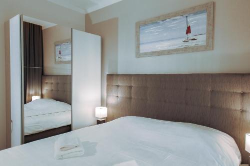 Postel nebo postele na pokoji v ubytování Merepargi ApartHotel & Cafe