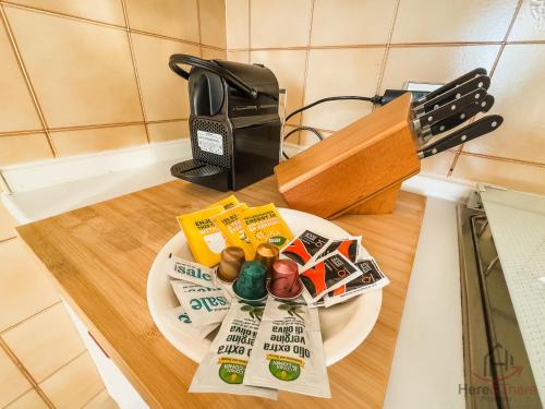 a plate of food on a counter next to a toaster at Ceriale for Fun - AquaPark & Beaches 5min - AC in Ceriale