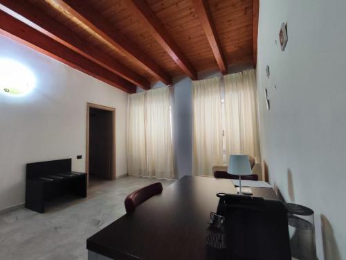 an office with a desk and chairs in a room at Hotel Quadrifoglio in Pontecagnano