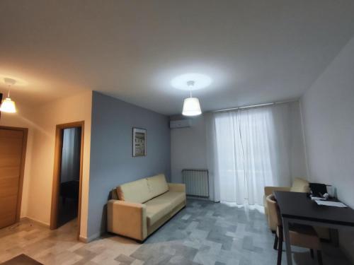 a living room with a couch and a table at Hotel Quadrifoglio in Pontecagnano