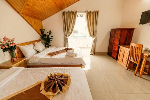 Postel nebo postele na pokoji v ubytování Lê Mùi Hotel - Apartment