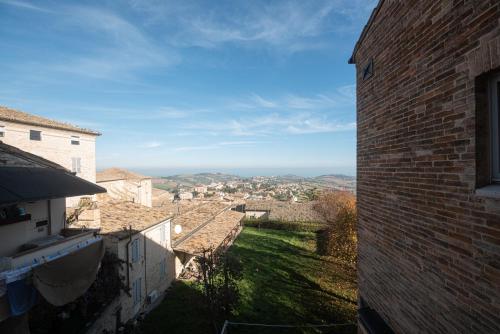 a view of a city from a brick building at Palazzo Capparucci - Dimora storica in Fermo