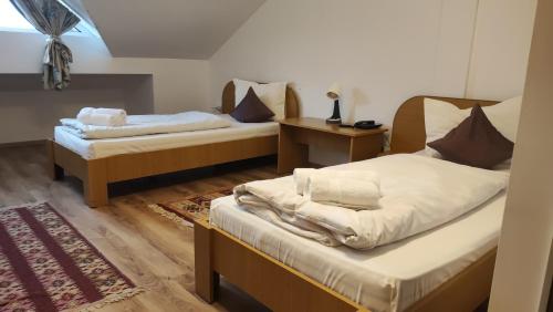 Letto o letti in una camera di MOTEL PRISLOP