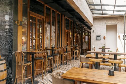 a row of tables and chairs in a restaurant at Maison Italia 1029 in Santiago